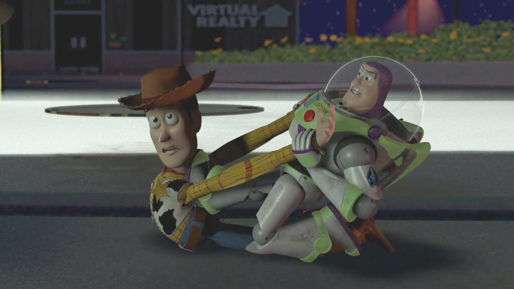 Escena de la película Toy Story. Vemos a Woody y Buzz discutiendo en un conflicto, pero parecen haberse detenido y miran hacia lo lejos